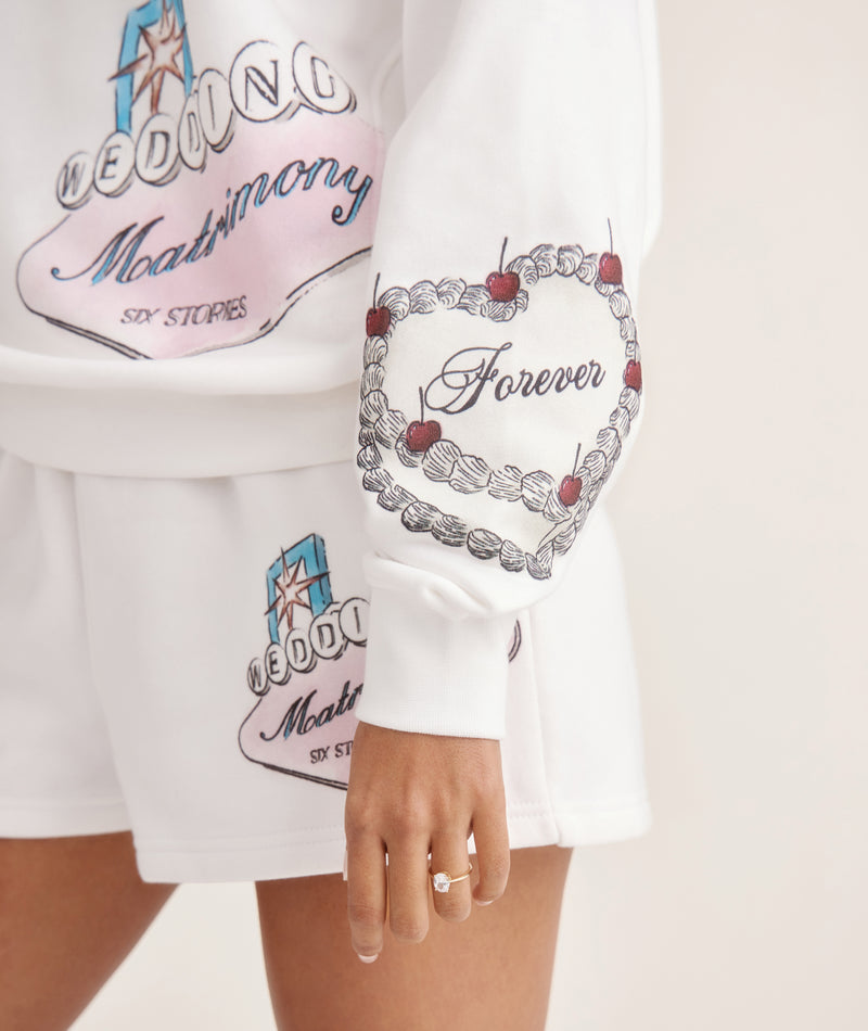 Close-up of Vegas bride sweatshirt with hand-drawn graphics